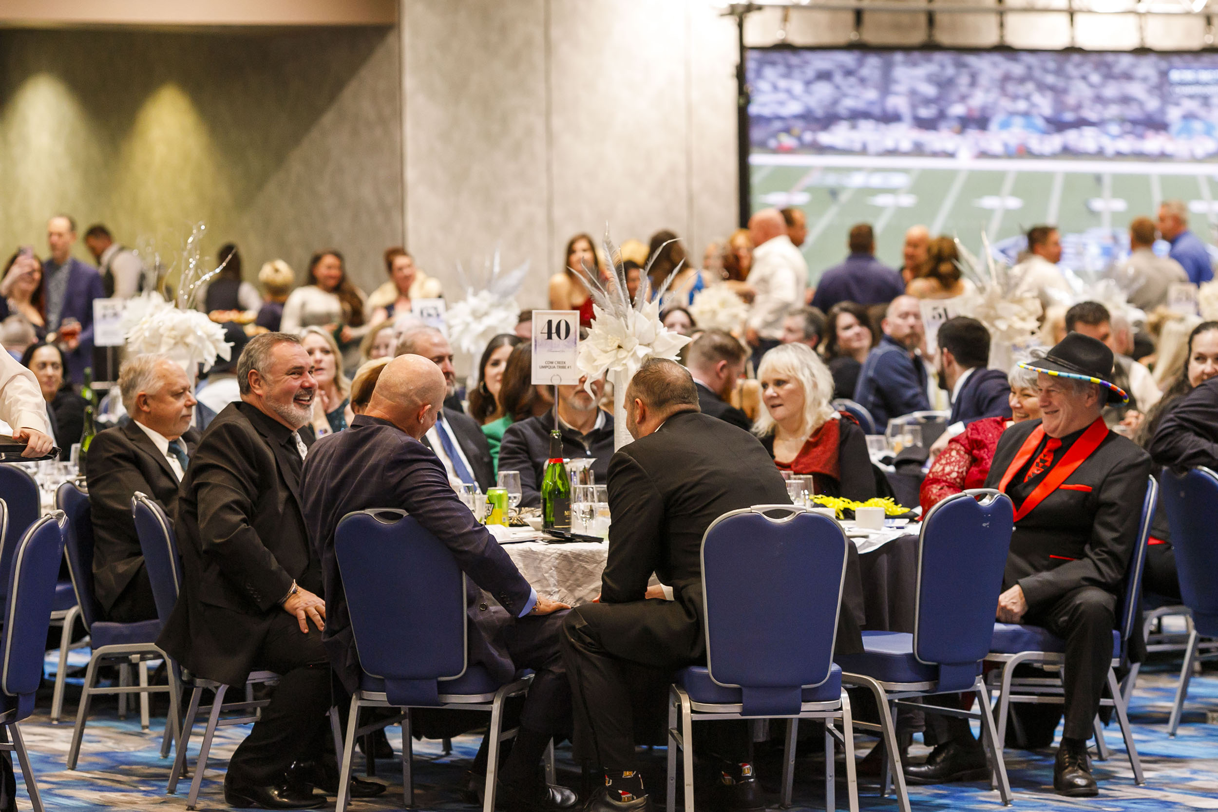 Table of people at an auction