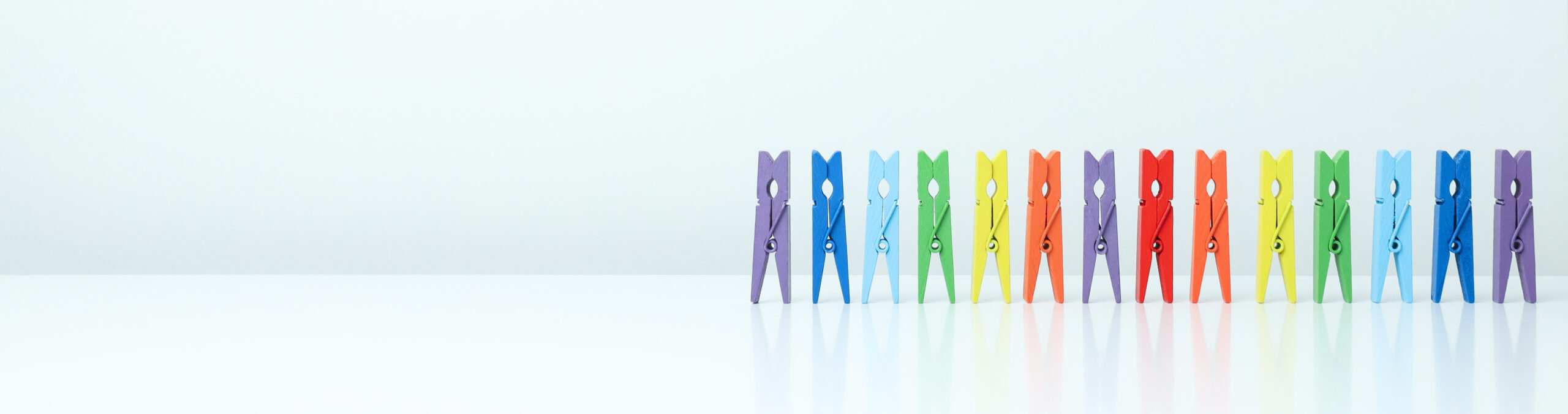 a row of colorful cloth pins