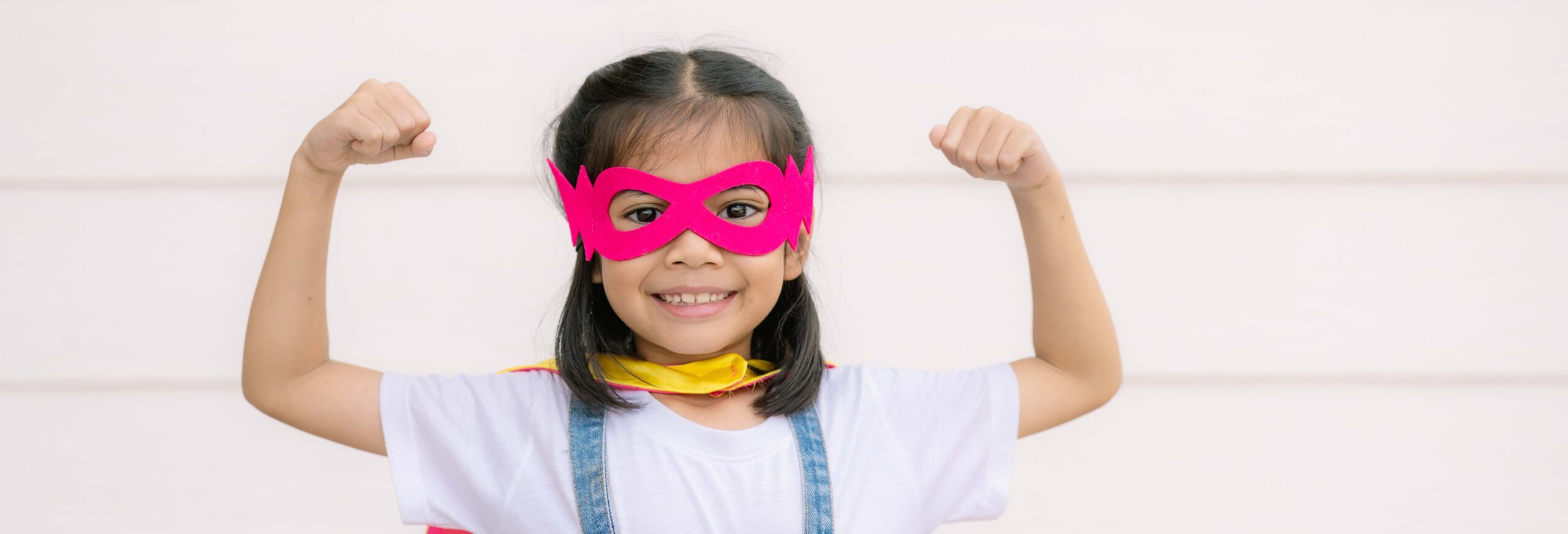 girl wearing super hero mask